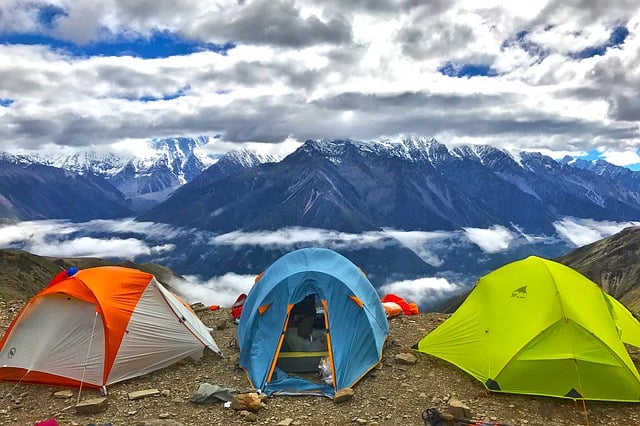 3 tents set up on a mountain