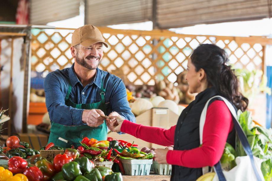 vendor selling to a customer at a Los Angeles farmers market