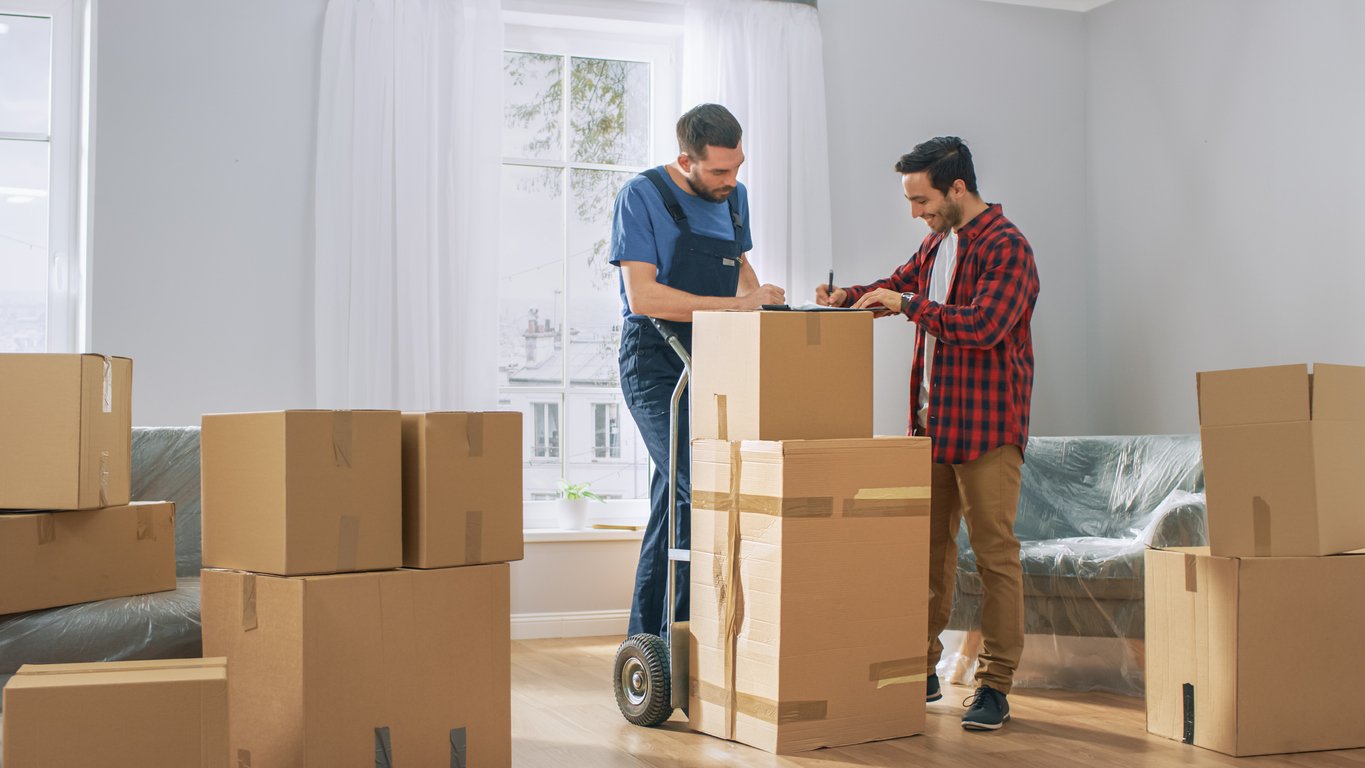 Homeowner talking with movers on move-out day